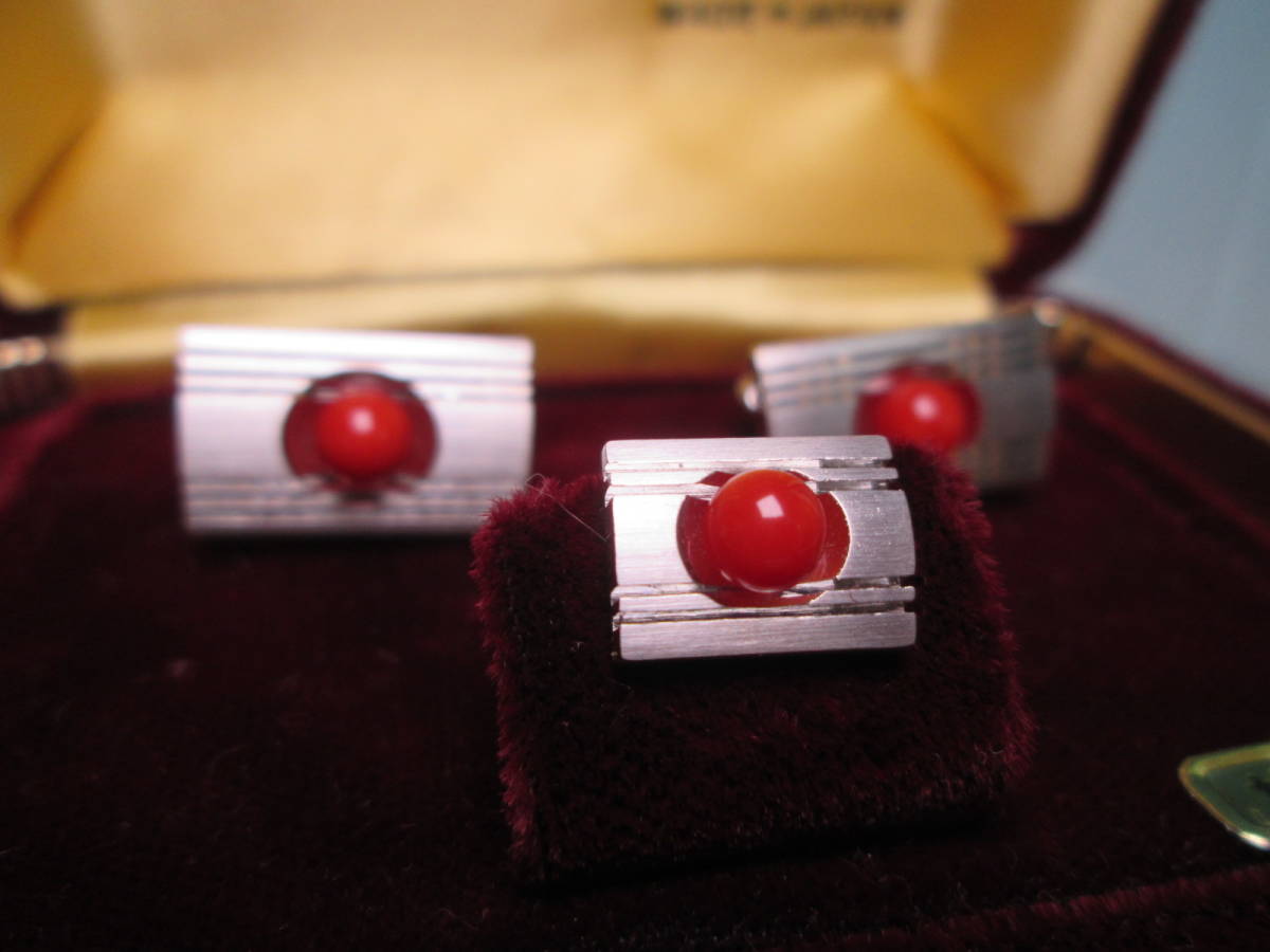 * red .. sphere decoration. design cuffs & tiepin also case attaching 