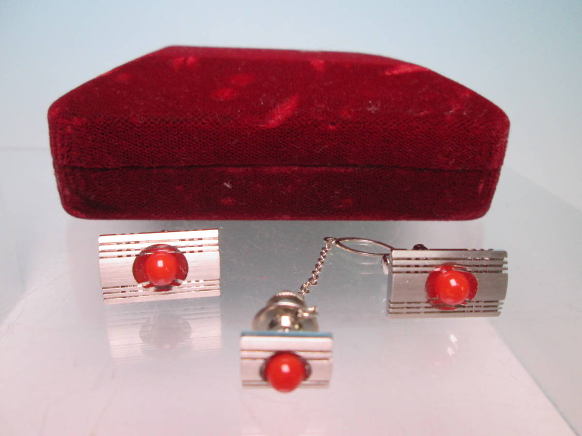 * red .. sphere decoration. design cuffs & tiepin also case attaching 