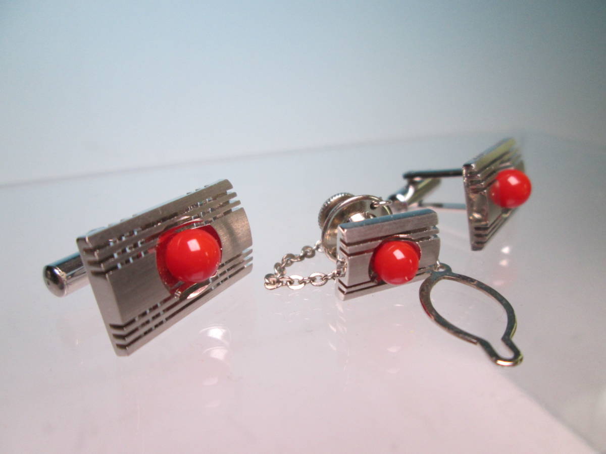 * red .. sphere decoration. design cuffs & tiepin also case attaching 