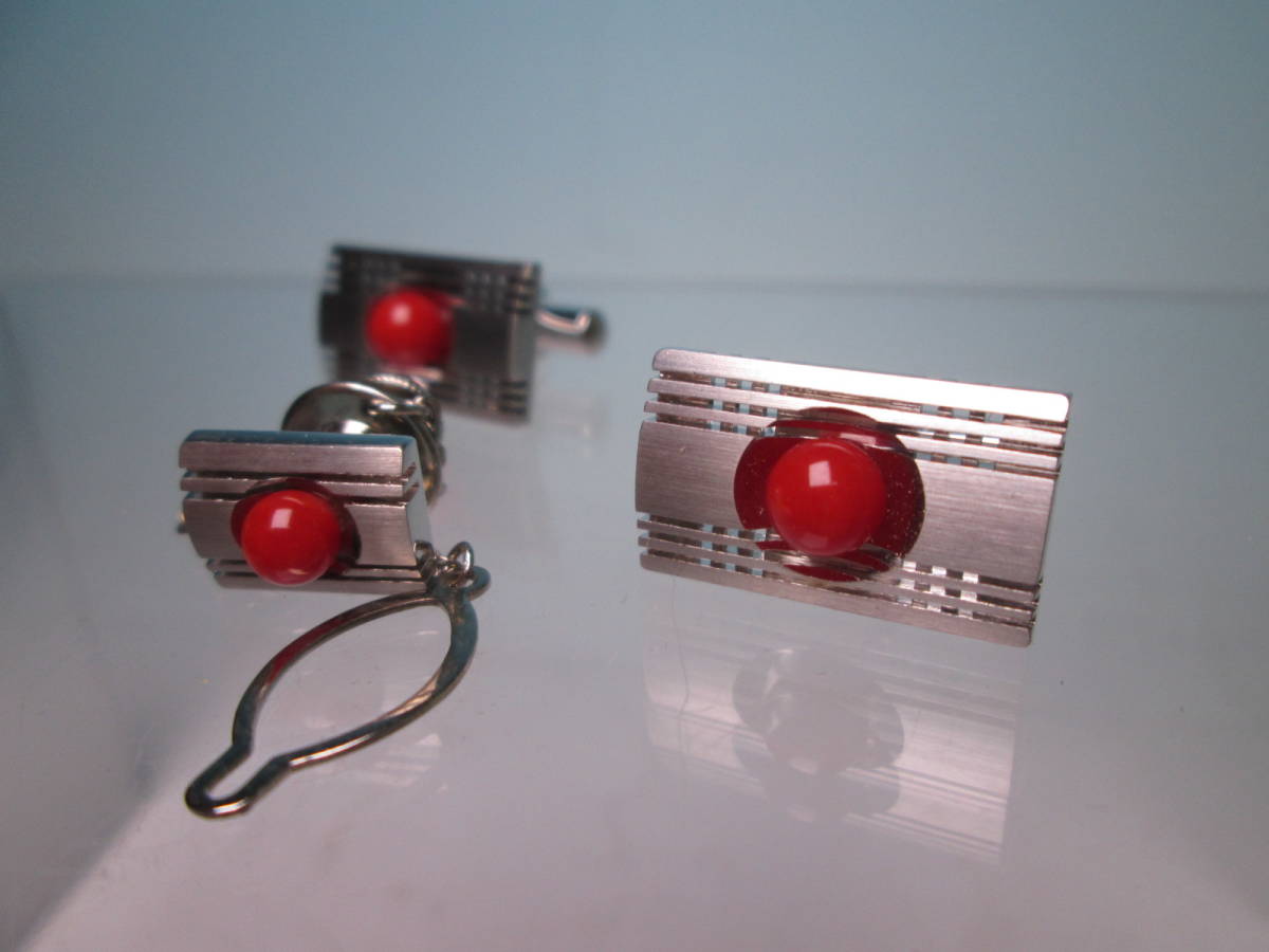 * red .. sphere decoration. design cuffs & tiepin also case attaching 