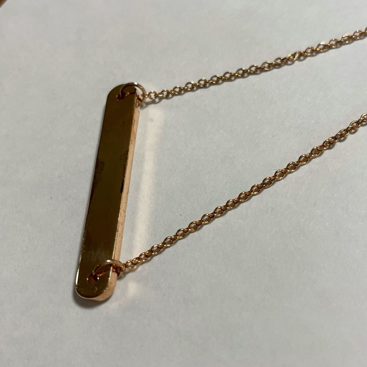 COACH メタル ロゴ プレート コーチ　ラインストーン　ネックレス　ホワイト　レディース　アクセサリー ペンダント