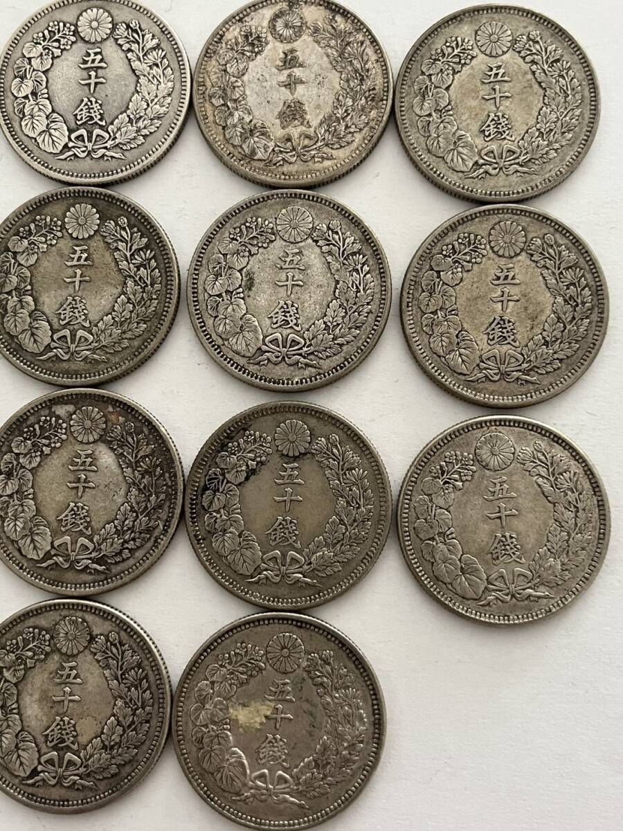 〇館100p 旭日50銭銀貨まとめて18枚 約182g 明治39年×4枚 40年×3 〇館100p 旭日50銭銀貨まとめて18枚 約182g 明治39年×4枚 40年×3