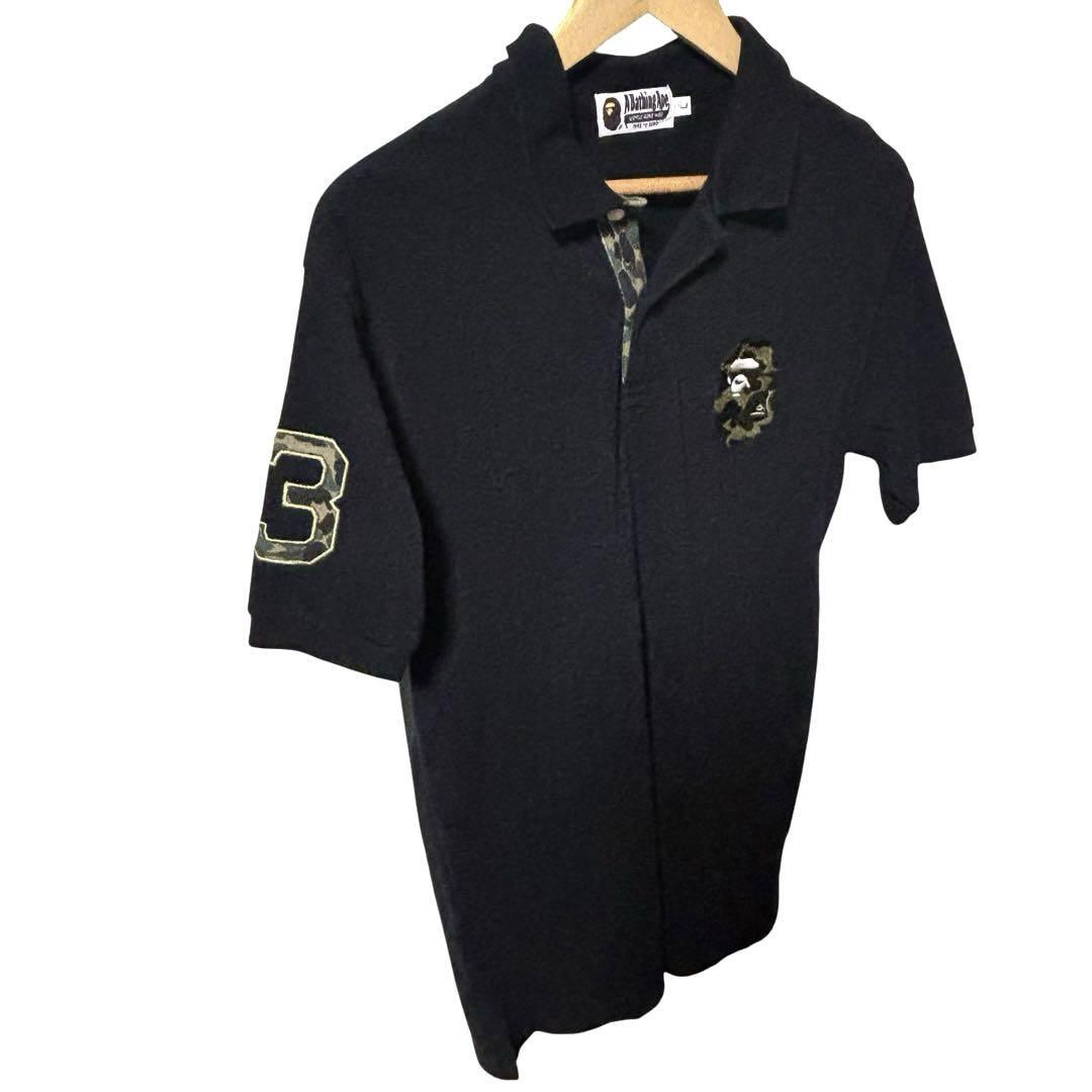 A BATHING APE アベイシングエイプ ポロシャツ ブラック×カモ L A BATHING APE アベイシングエイプ ポロシャツ ブラック×カモ L