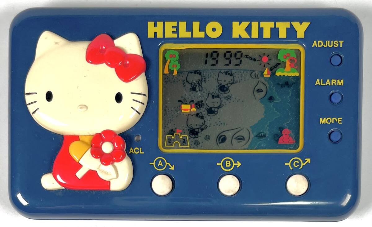 TOMY Hello Kitty [si- боковой Hori te-] жидкокристаллический игра ( Tommy /HELLO KITTY/SEASIDE HOLIDAY/LCD GAME/ вместе с ящиком / Showa Retro /JUNK)
