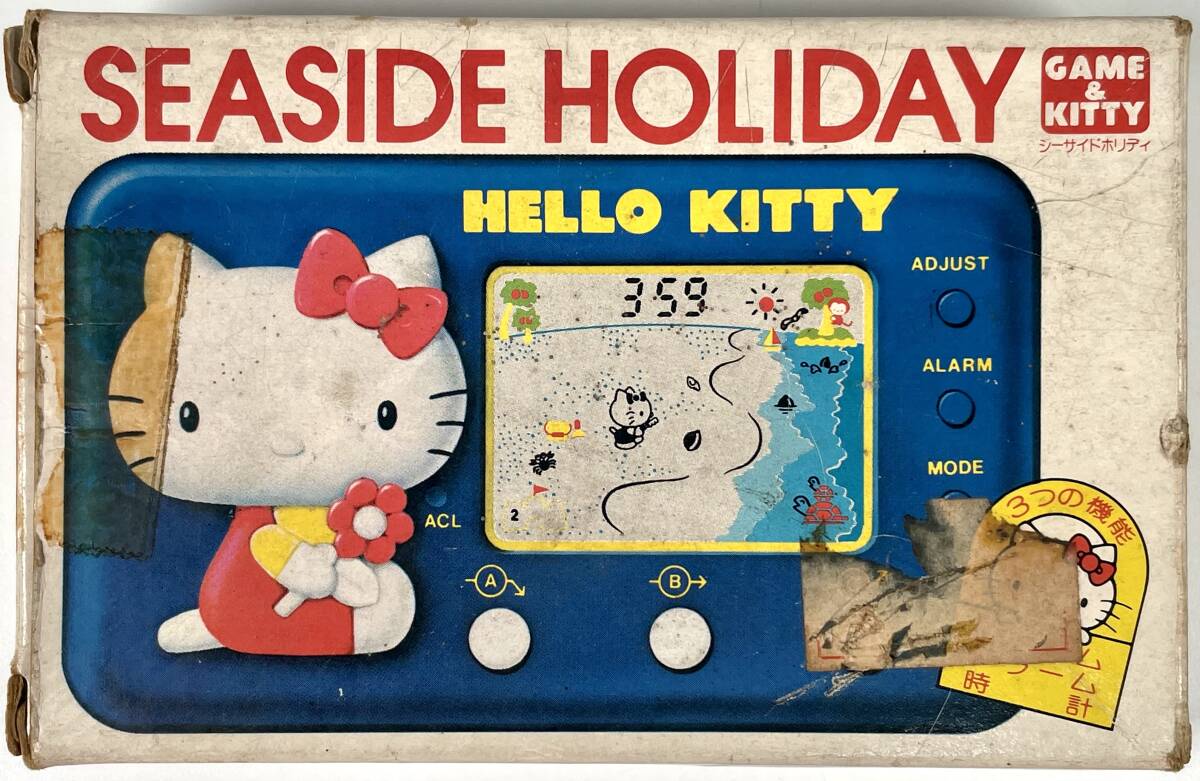 TOMY Hello Kitty [si- боковой Hori te-] жидкокристаллический игра ( Tommy /HELLO KITTY/SEASIDE HOLIDAY/LCD GAME/ вместе с ящиком / Showa Retro /JUNK)
