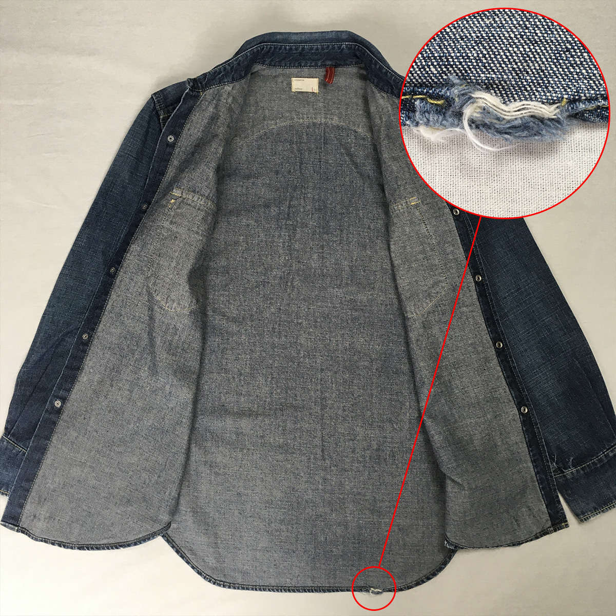背面裾のステッチに一部解れあり