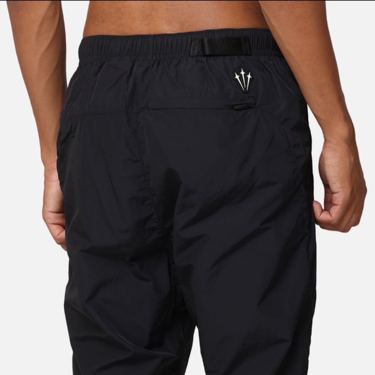 M】Nike Nocta ナイキ ノクタ ナイロン トラックパンツ 黒 新品 M】Nike Nocta ナイキ ノクタ ナイロン トラックパンツ 黒 新品