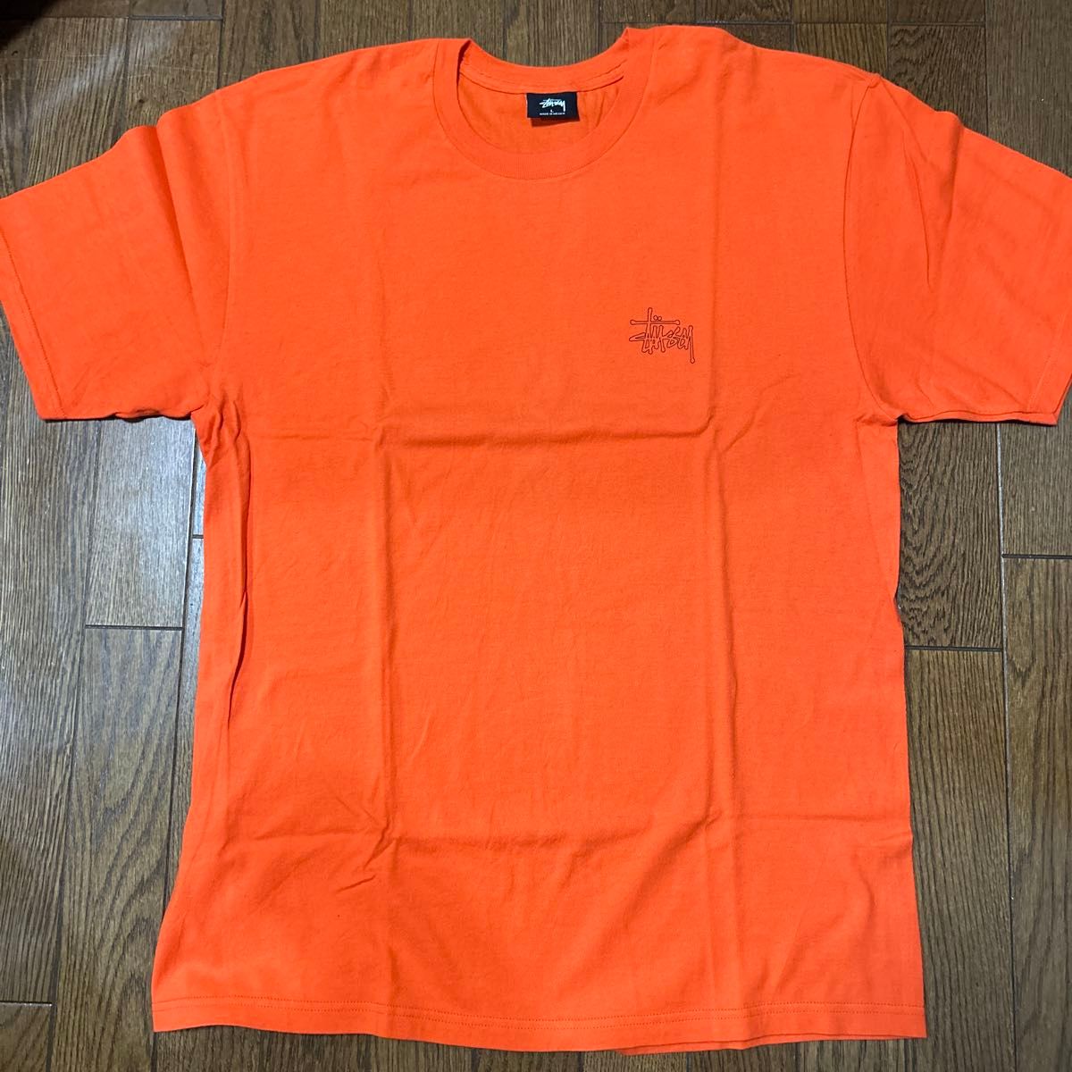 stussy バックプリント オレンジTシャツ Lサイズ USED stussy バックプリント オレンジTシャツ Lサイズ USED