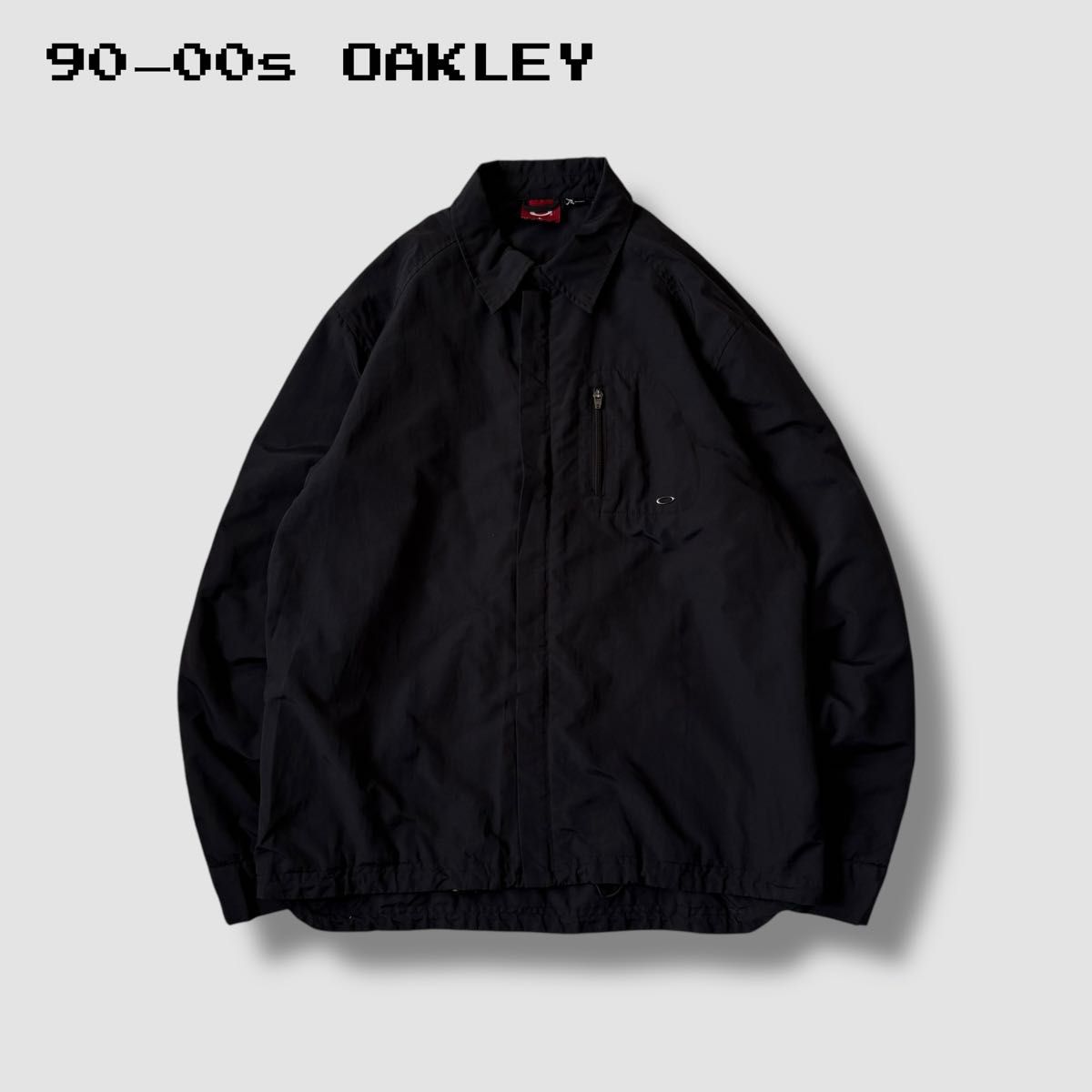 90~00s OAKLEY オークリー ナイロンコーチジャケット メタルロゴ 90~00s OAKLEY オークリー ナイロンコーチジャケット メタルロゴ