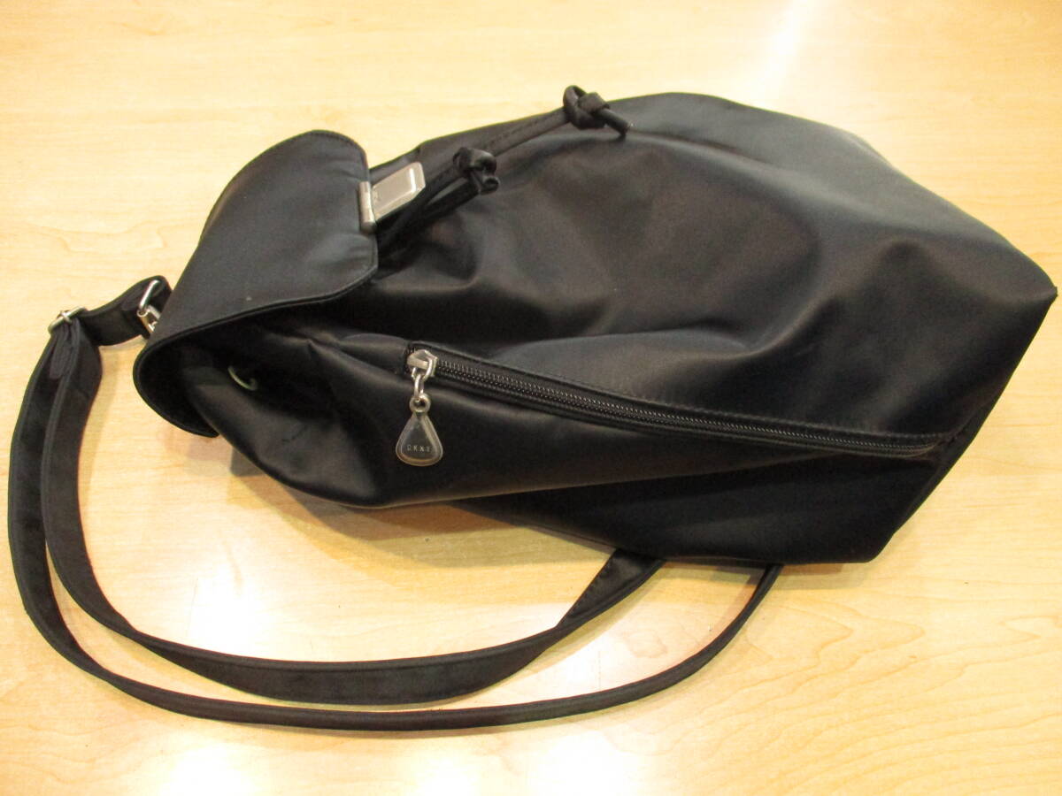 DKNY ダナキャランニューヨーク ナイロン 巾著 ワンショルダー ボディ バッグ 無地 ブラック シルバーカラー 金具 鞄 カバン USED品
