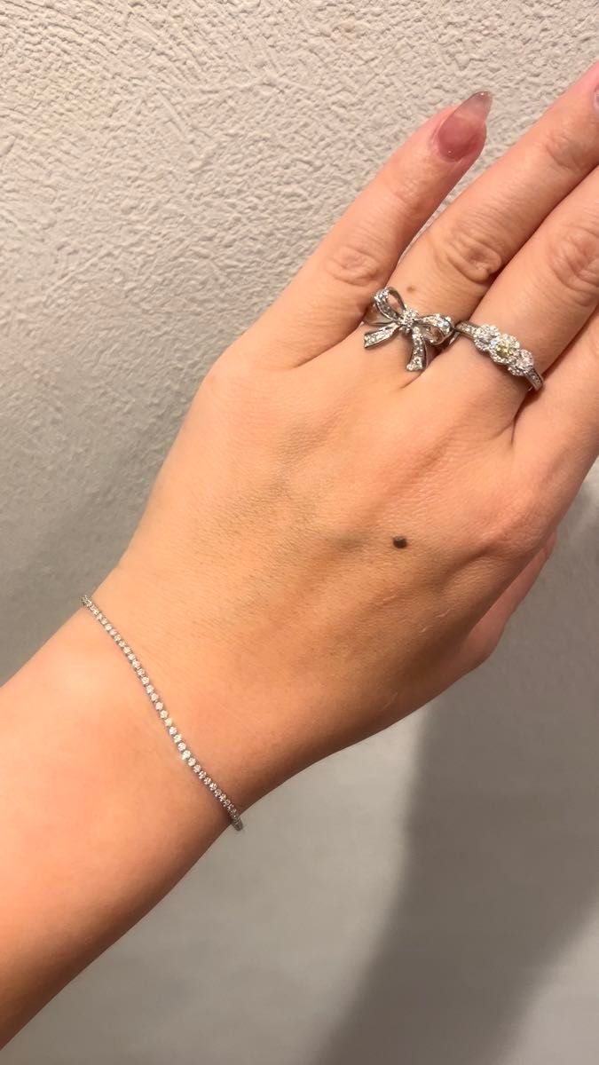 K18WGリボンリング4.64g ダイヤ0.24ct