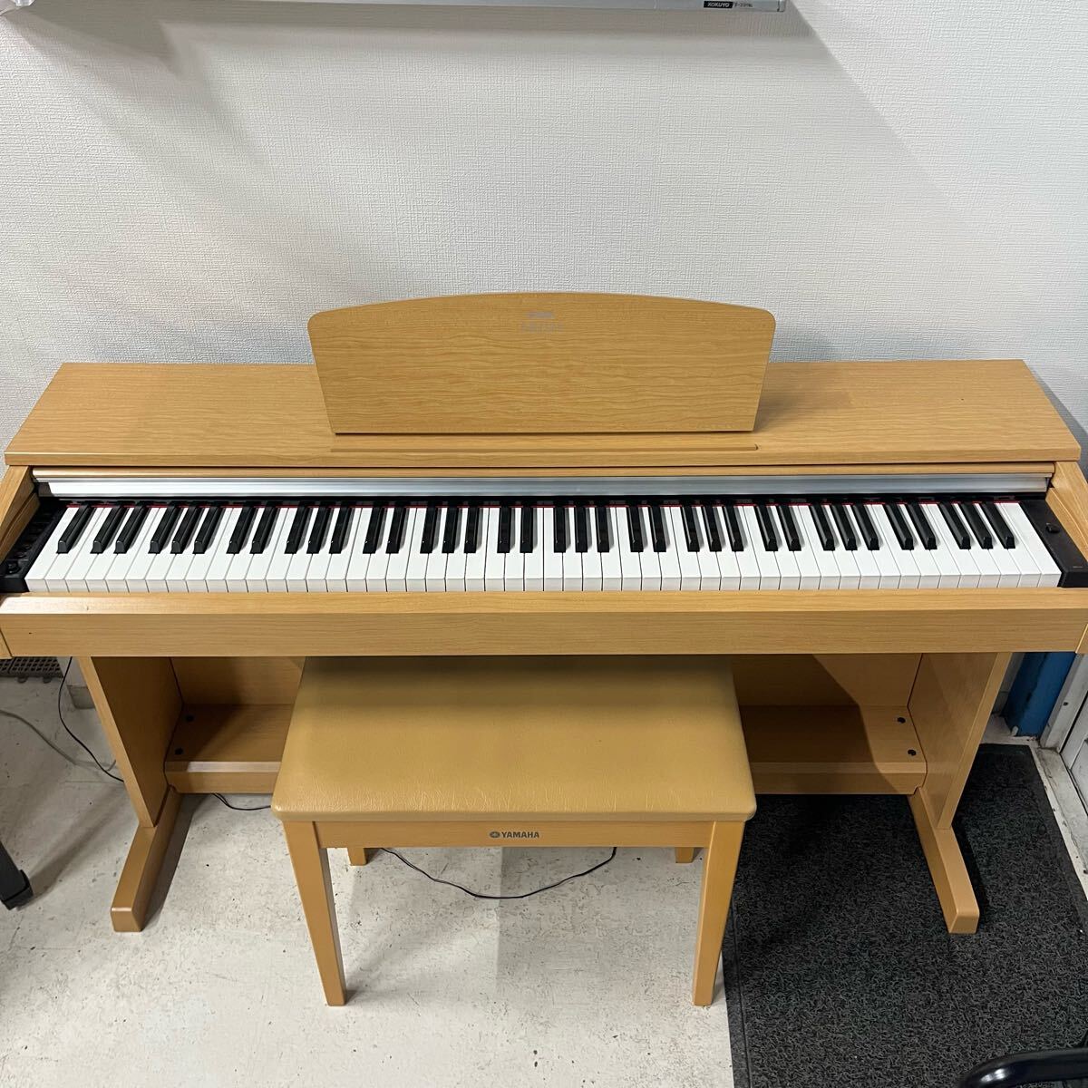 Yamaha Arius YDP-141 digital piano and stool in dark
