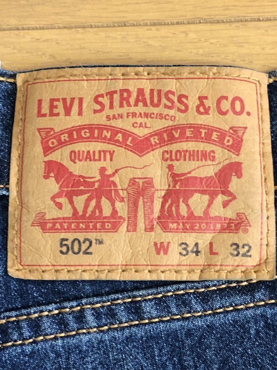 Levi's 502 TAPER COOL WORN INダークインディゴW34 L32