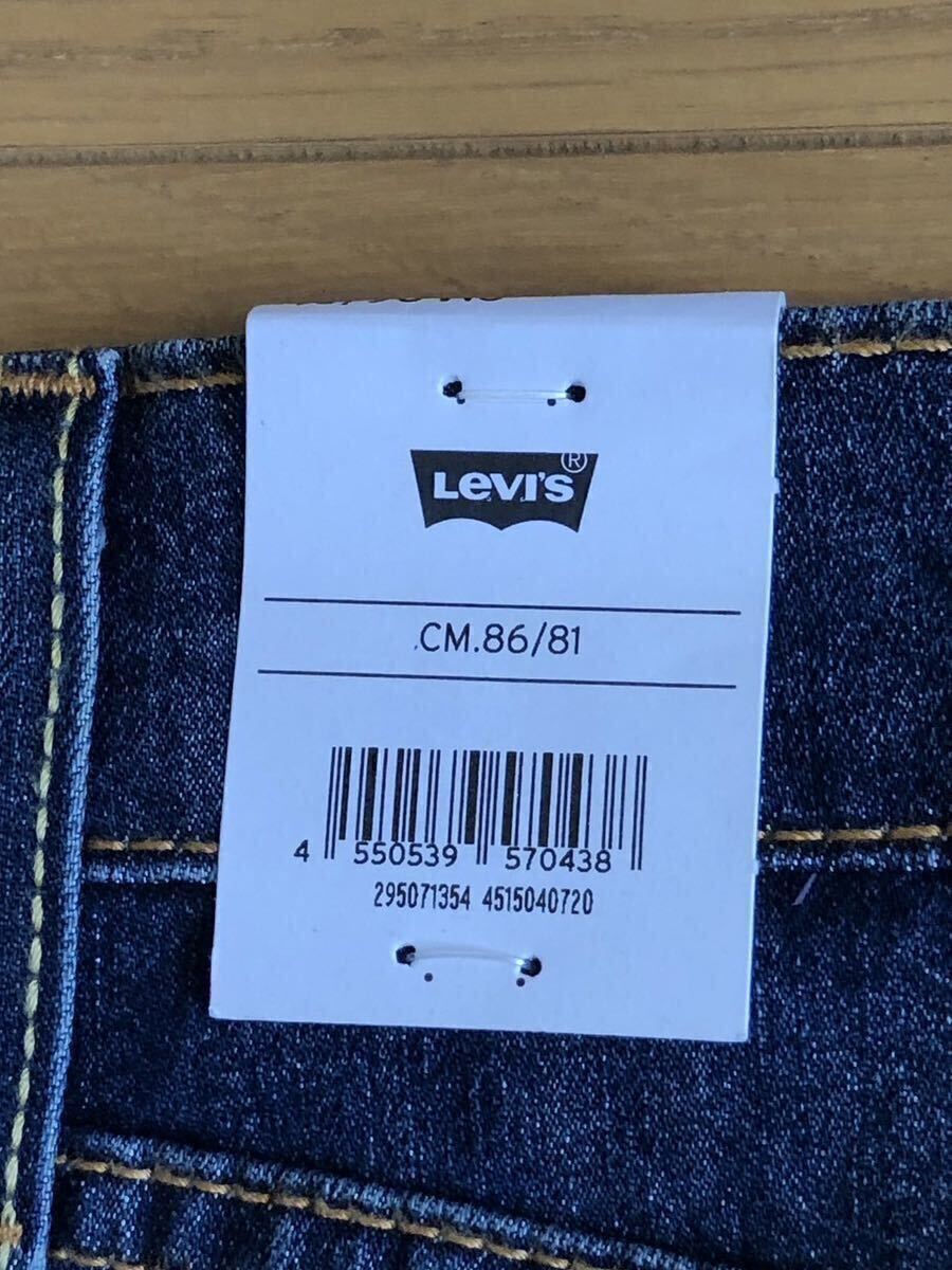 Levi's 502 TAPER COOL WORN INダークインディゴW34 L32