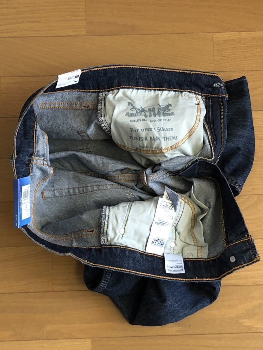 Levi's 502 TAPER COOL WORN INダークインディゴW34 L32
