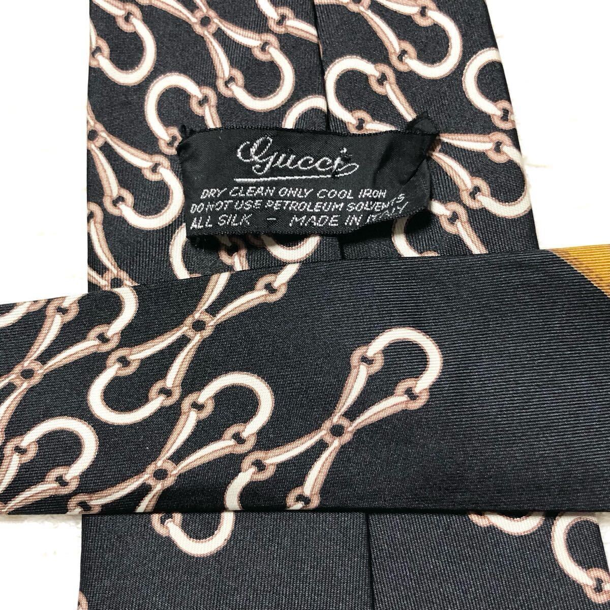 ■美品■GUCCI グッチ　ネクタイ　スカーフ柄　金具　ベルト　馬具　総柄　シルク100% イタリア制　ブラック×ベージュ×キャラメユ?