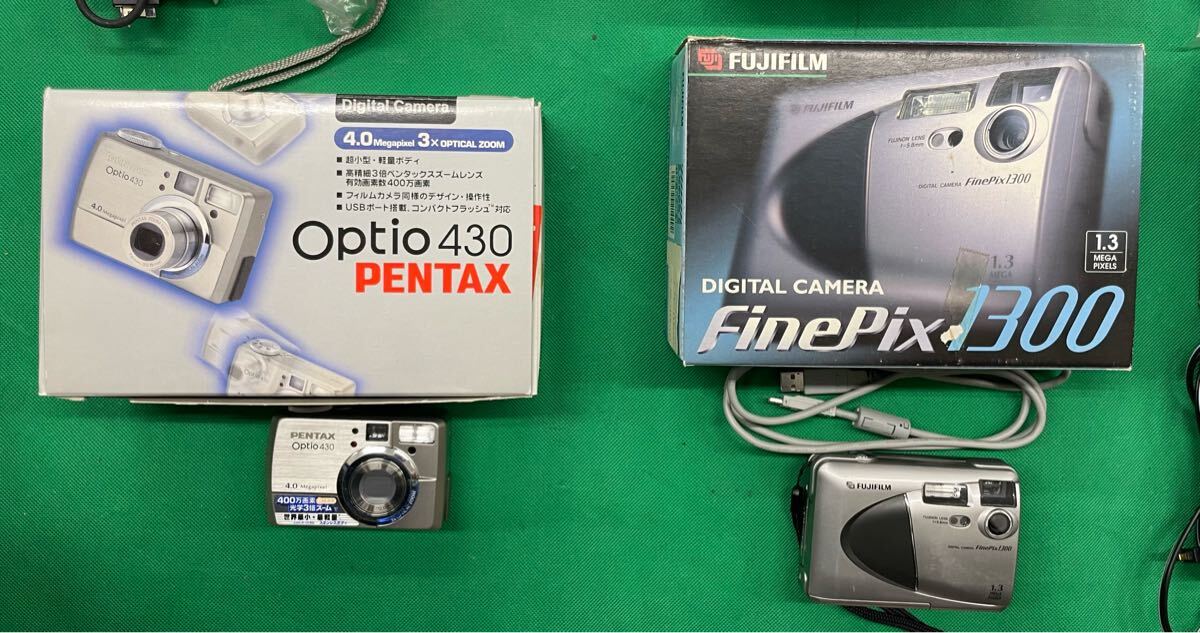 （E129）12個 デジタルカメラ まとめ売り SONY Nikon FUJIFILM OLYMPUS など ジャンク 動作未確認 元箱付き 含充電器付き 