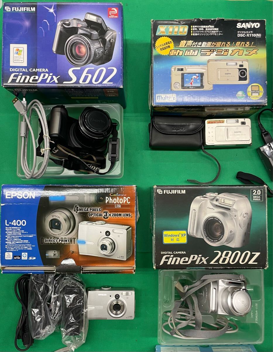 （E129）12個 デジタルカメラ まとめ売り SONY Nikon FUJIFILM OLYMPUS など ジャンク 動作未確認 元箱付き 含充電器付き 