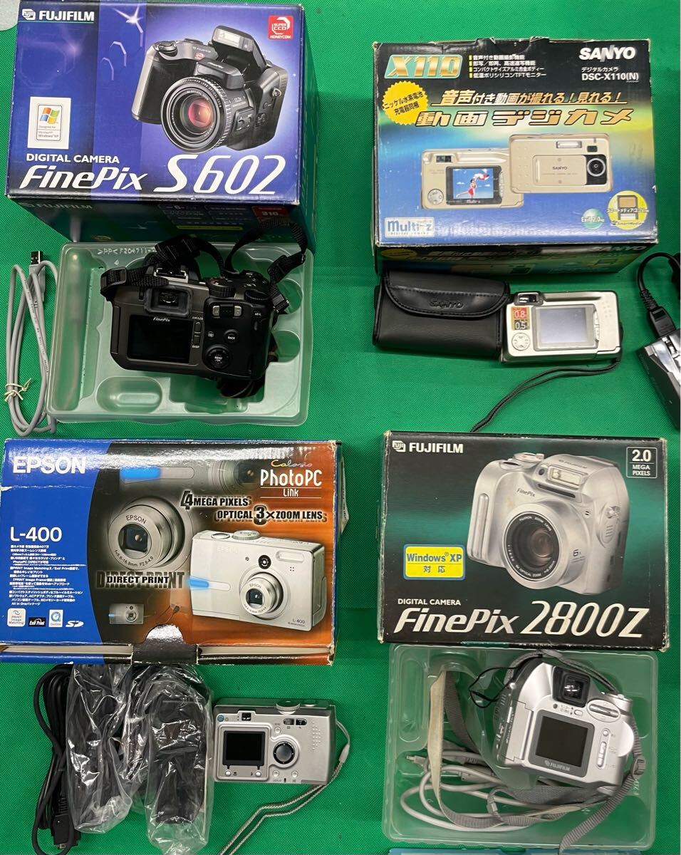 （E129）12個 デジタルカメラ まとめ売り SONY Nikon FUJIFILM OLYMPUS など ジャンク 動作未確認 元箱付き 含充電器付き 