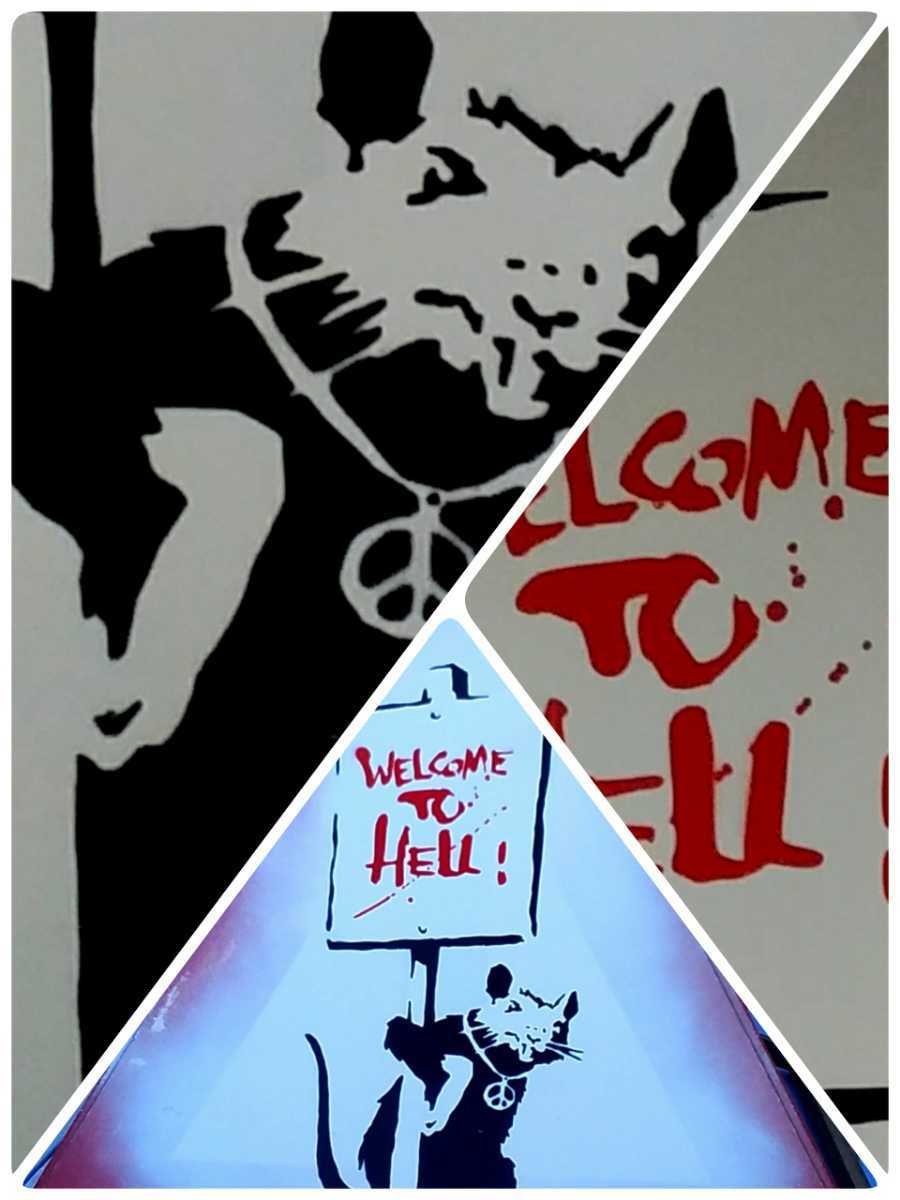 Banksy( Bank si-). load autograph,[Welcome To Hell] road sign.2004 year about England. south west,Somerset close. Glastonbury. discovery was done work 
