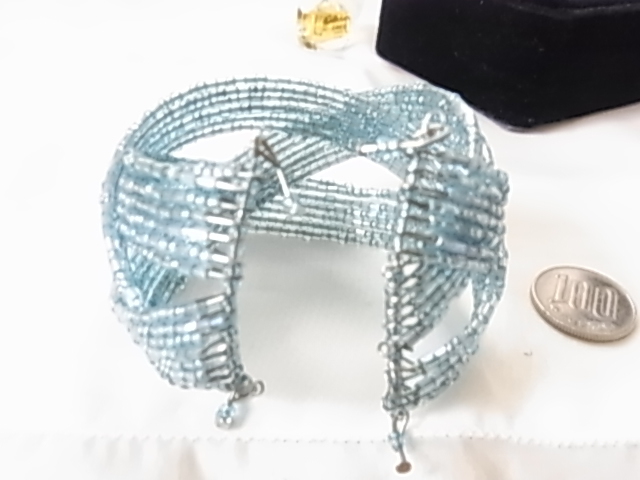  unused new goods .. seems to be . Sky blue color light blue empty color Kirakira lustre feeling exist beads. compilation included width approximately 4.5 centimeter bangle bracele **