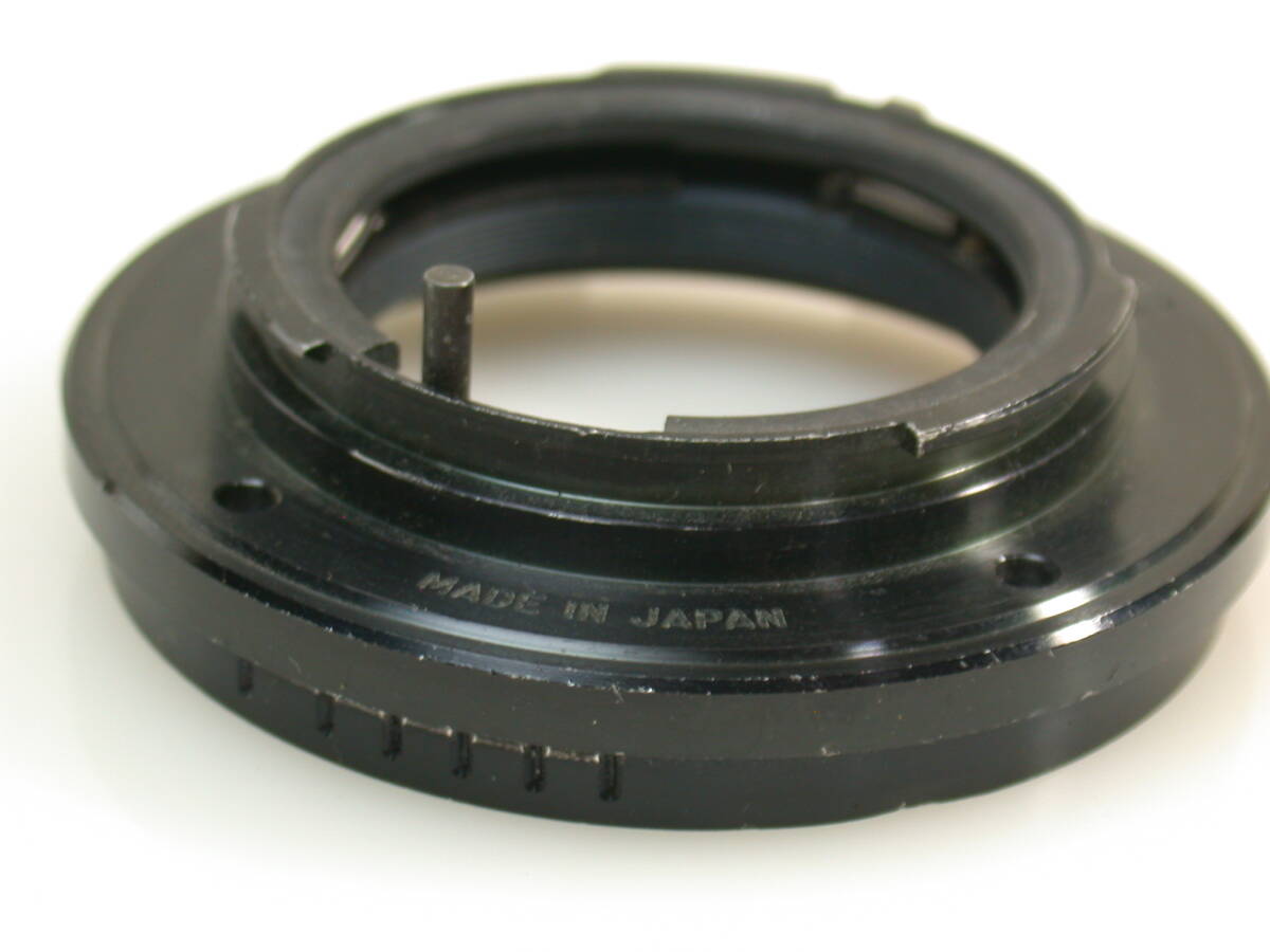 18-56 ミノルタSRマウント コムラーユニマウントの殘骸か？