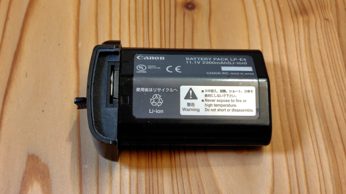キヤノン　 CANON　純正バッテリーパック　LP-E4 ジャンク_画像1