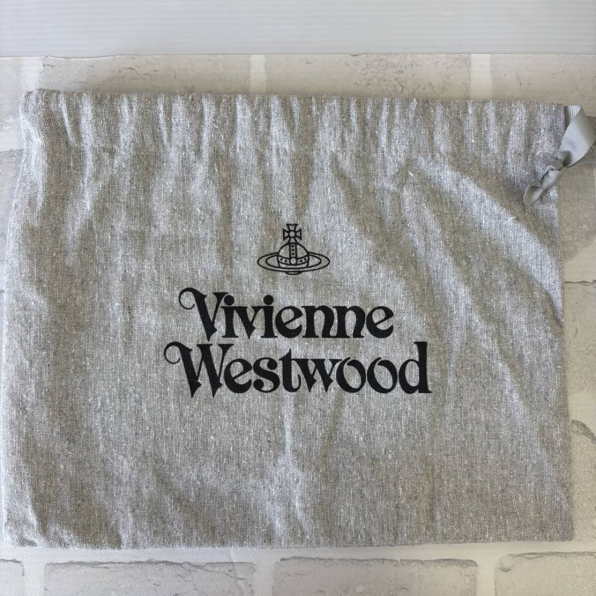 【TF0909？】Vivienne Westwood スマホケース スマホポーチ 虎？ 黒 巾著付き