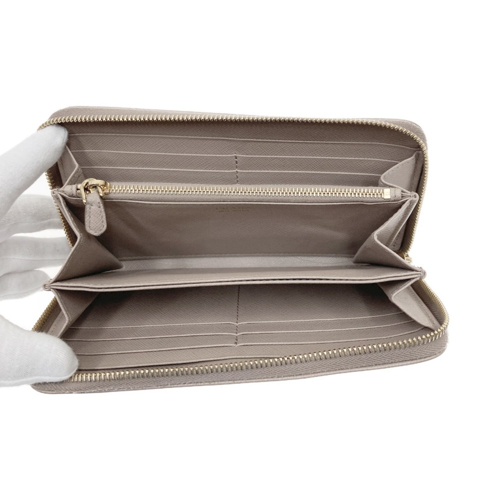 00 PRADA Prada safia-no длинный кошелек раунд застежка-молния 1ML506 бежевый немного царапина . загрязнения есть 