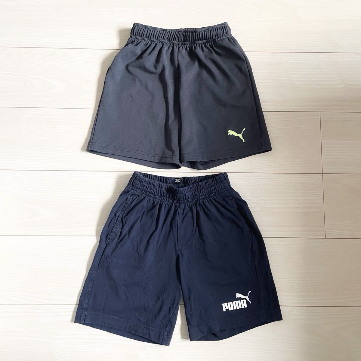 PUMA◆ハーフパンツ 2枚セット ネイビー グレー 130 2着 まとめ売り プーマ 短パン スポーツ 速乾 コットン 綿 ウエストゴム_画像1