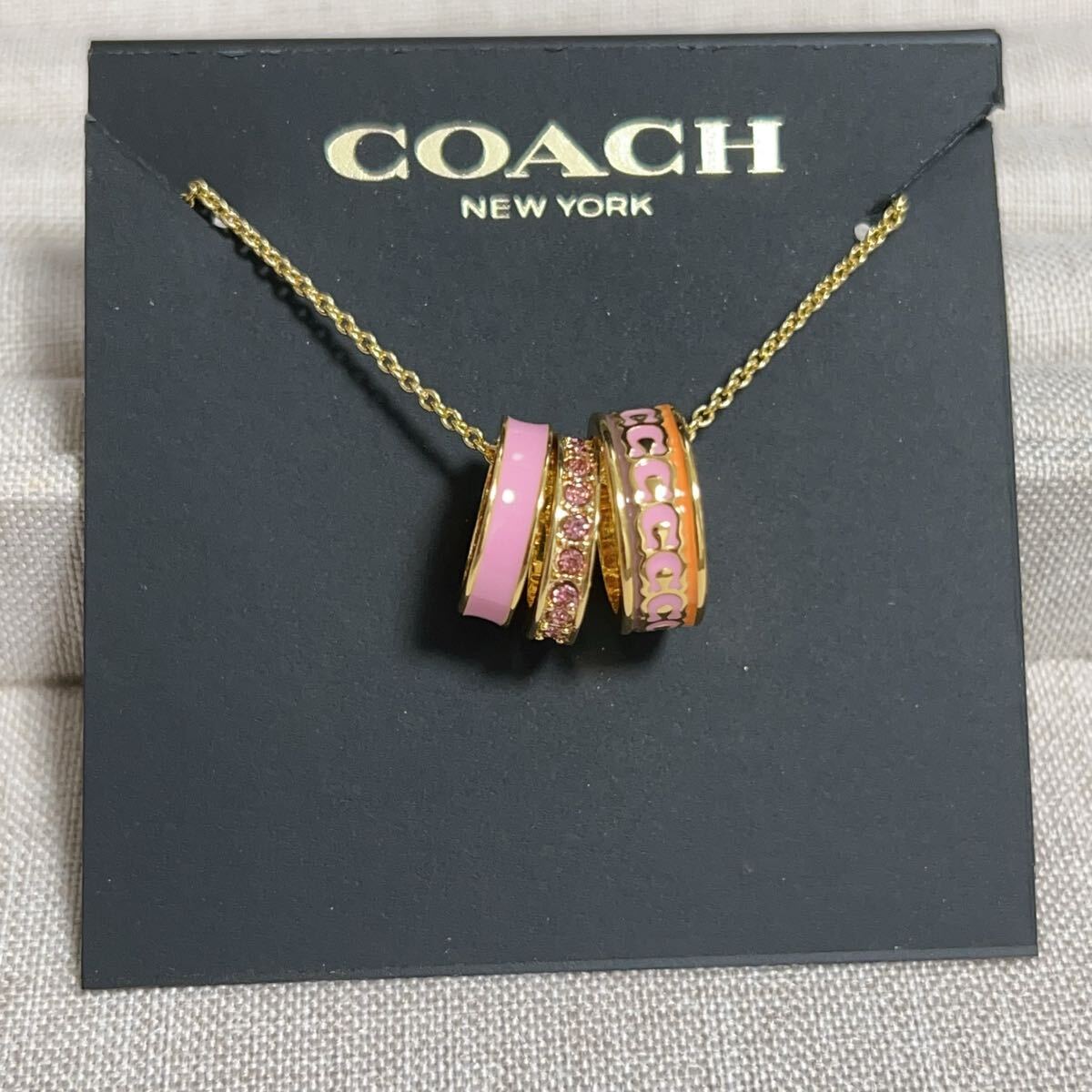 新品未使用　CH017 COACH コーチ　ネックレス　エナメル　リングチャーム　ピンクxゴールド_画像1