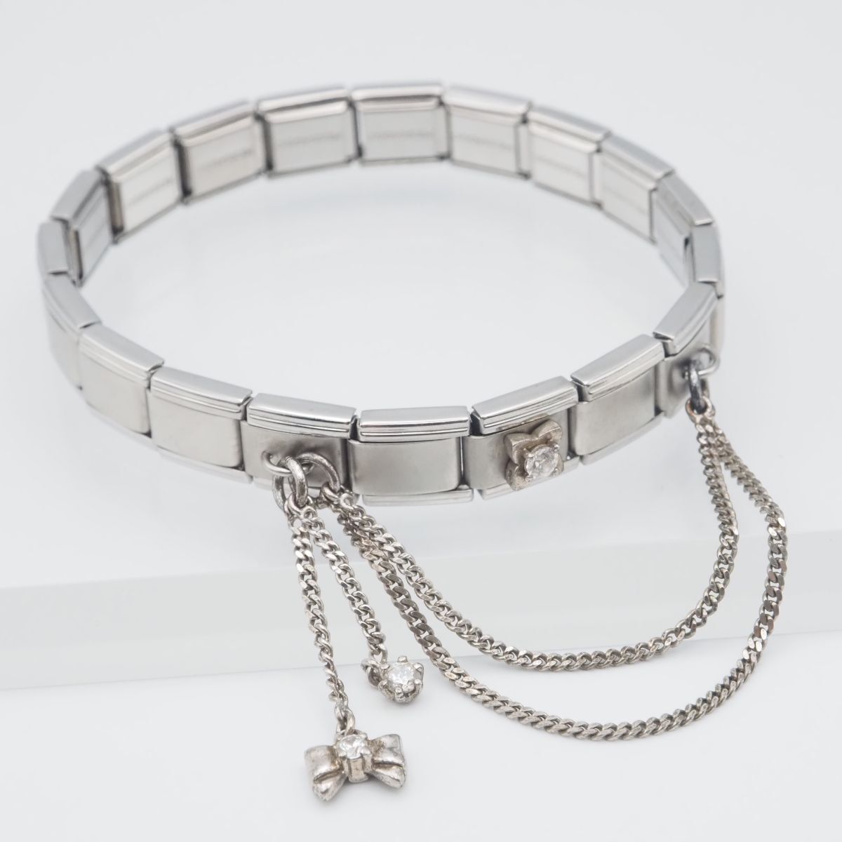 F474 MESSAGGIO メッサジオ ブレスレットダイヤモンド風 チェーン リボン デザイン シルバー_画像1