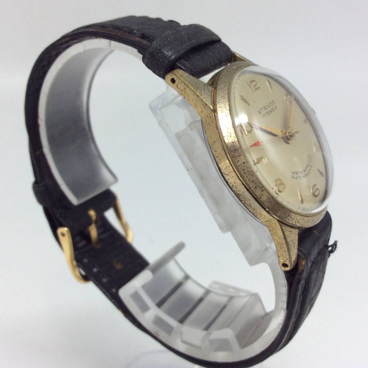 EE67△【手巻き/稼働】腕時計 STANCO スタンコ 17石 3針 ゴールドカラー ラウンド ※社外ベルト 現状品_画像3