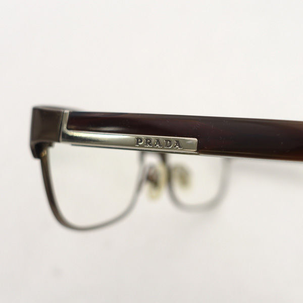 # Prada раз имеется очки Logo plate темно-красный titanium (0990014263)