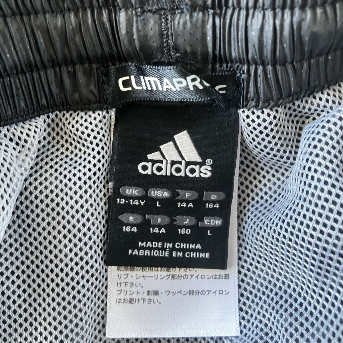 アディダス adidas ナイロンパンツ ウエストゴム ブラック 古著 シャカシャカ ウインドブレーカー 3554