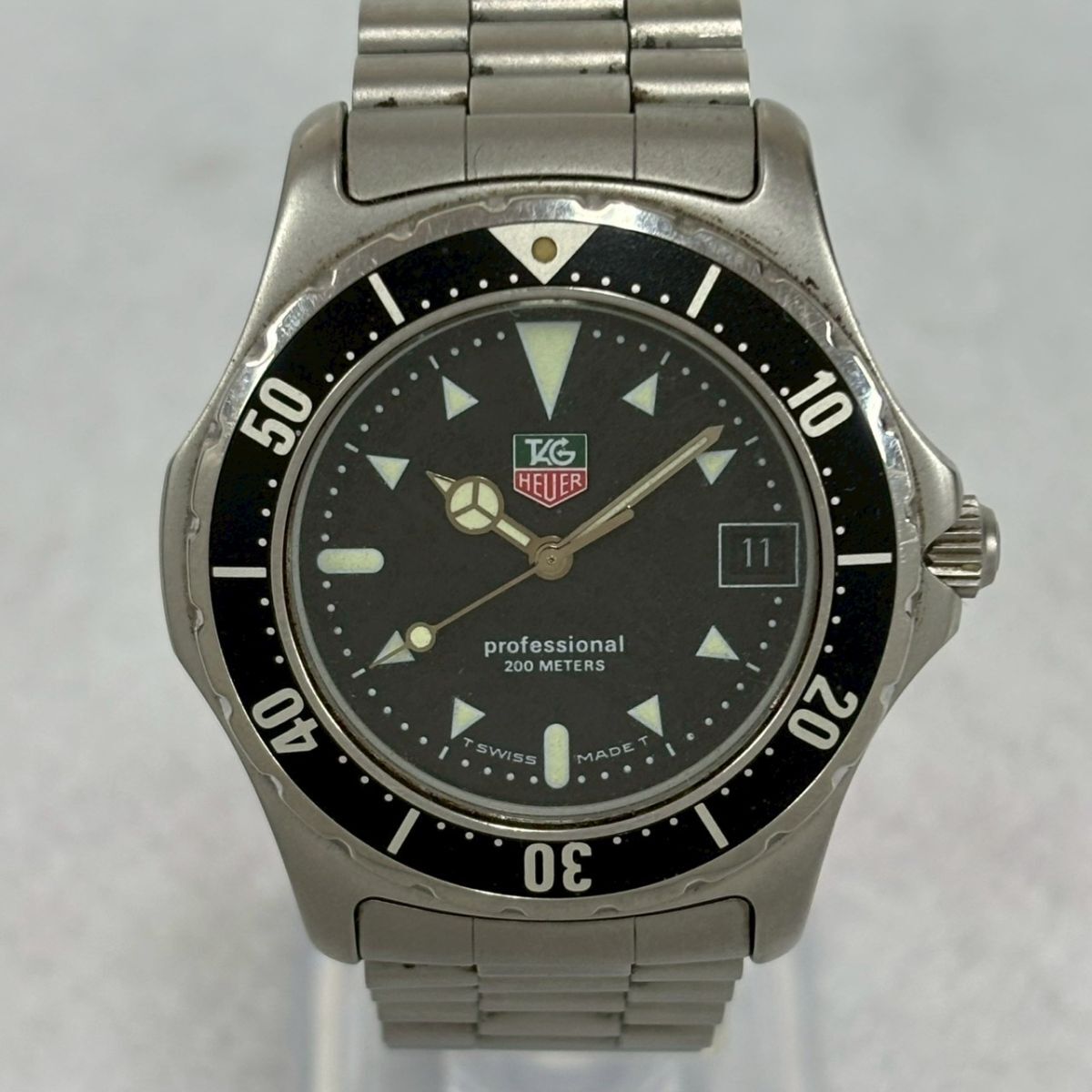 H426-O53-1949◎TAG HEUER タグホイヤー プロフェッショナル 200m 973.006R-2 クォーツ デイト ブラック文字盤 メンズ 腕時計 OA_画像1