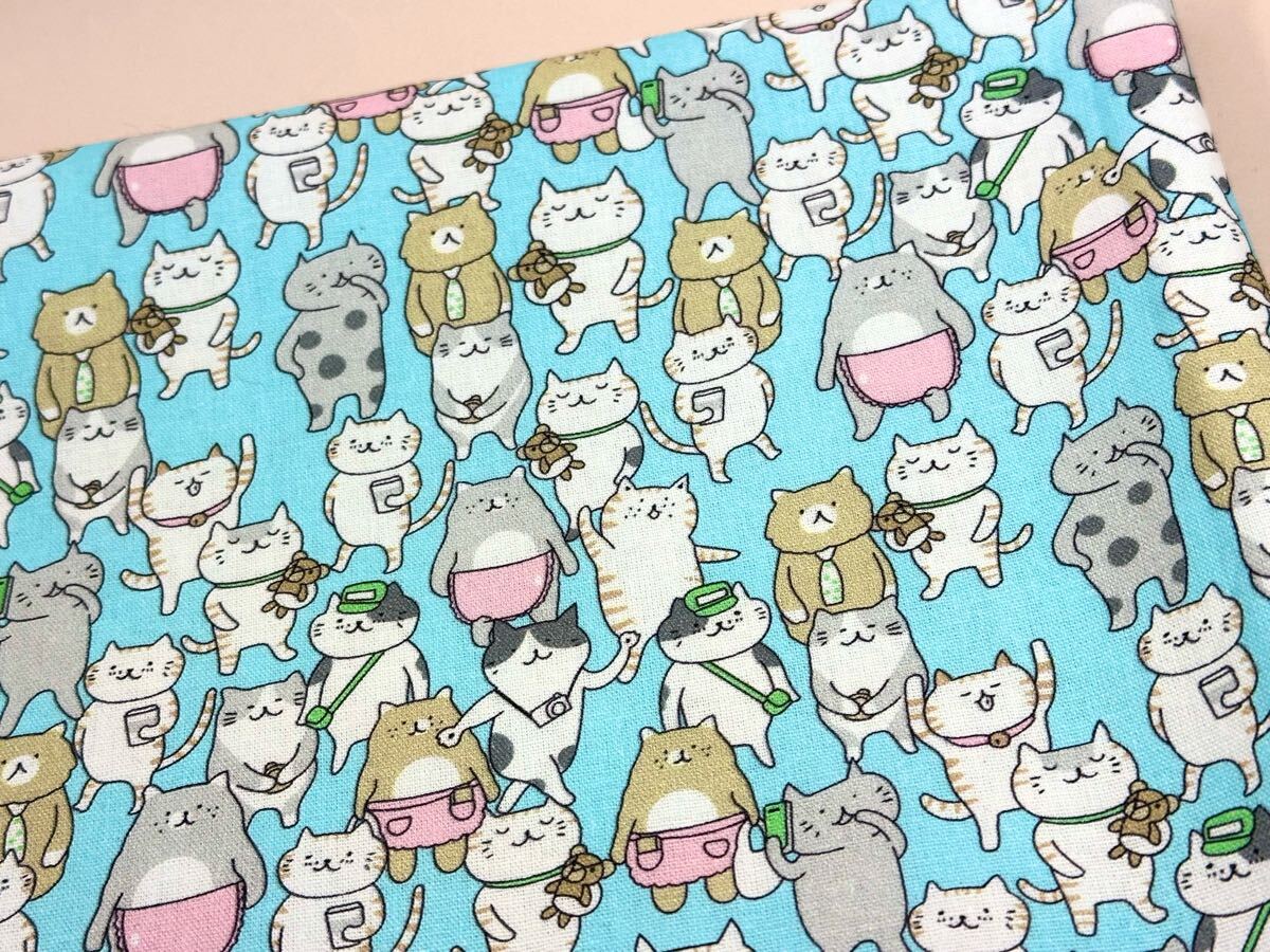 USAシーチング.綿100%生地.幅110cm×50cm.水色地.猫_画像1