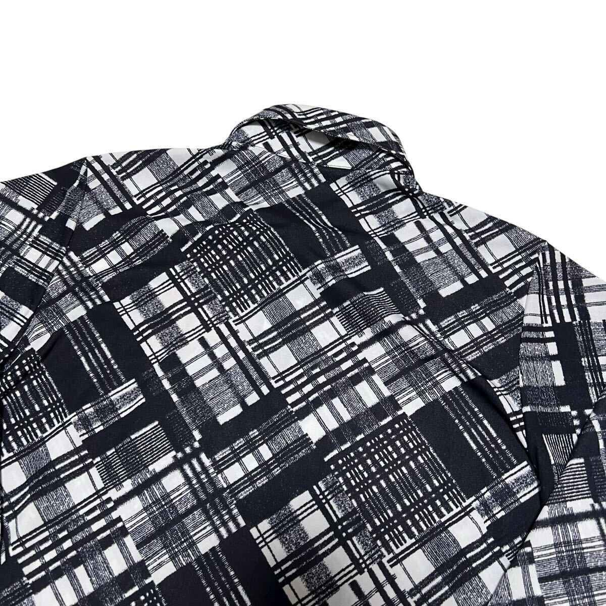 未使用品級 マンシングウェア 長袖ポロシャツ M ブラック×ホワイト 総柄 ポリエステル ゴルフウェア Munsingwear 1円〜_画像7