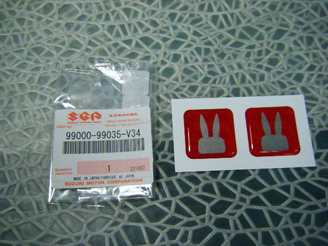 ♪定形　99000-99035-V34　スズキ　 純正　 Lapin　ラパンドアリフレクター オレンジ 2枚セット（3ｃｍｘ3ｃｍ）（要）在庫確認　（0711） _画像1