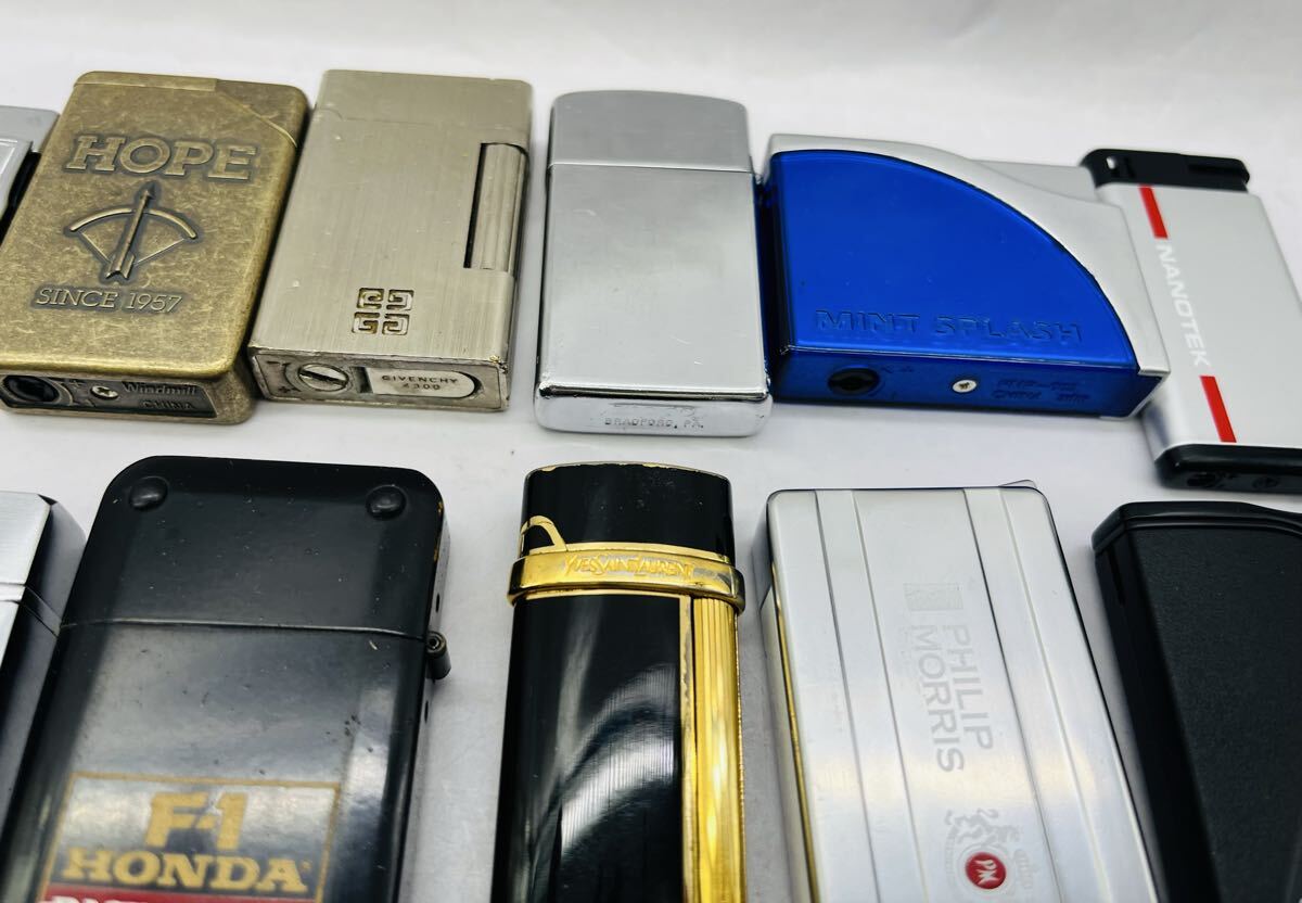 ◎1円◎ ブランド含む ライター45個まとめ売り zippo YSL ジバンシーマルマン タバコ銘柄他 色々まとめて 着火未確認 ジャンク★同梱不可_画像5