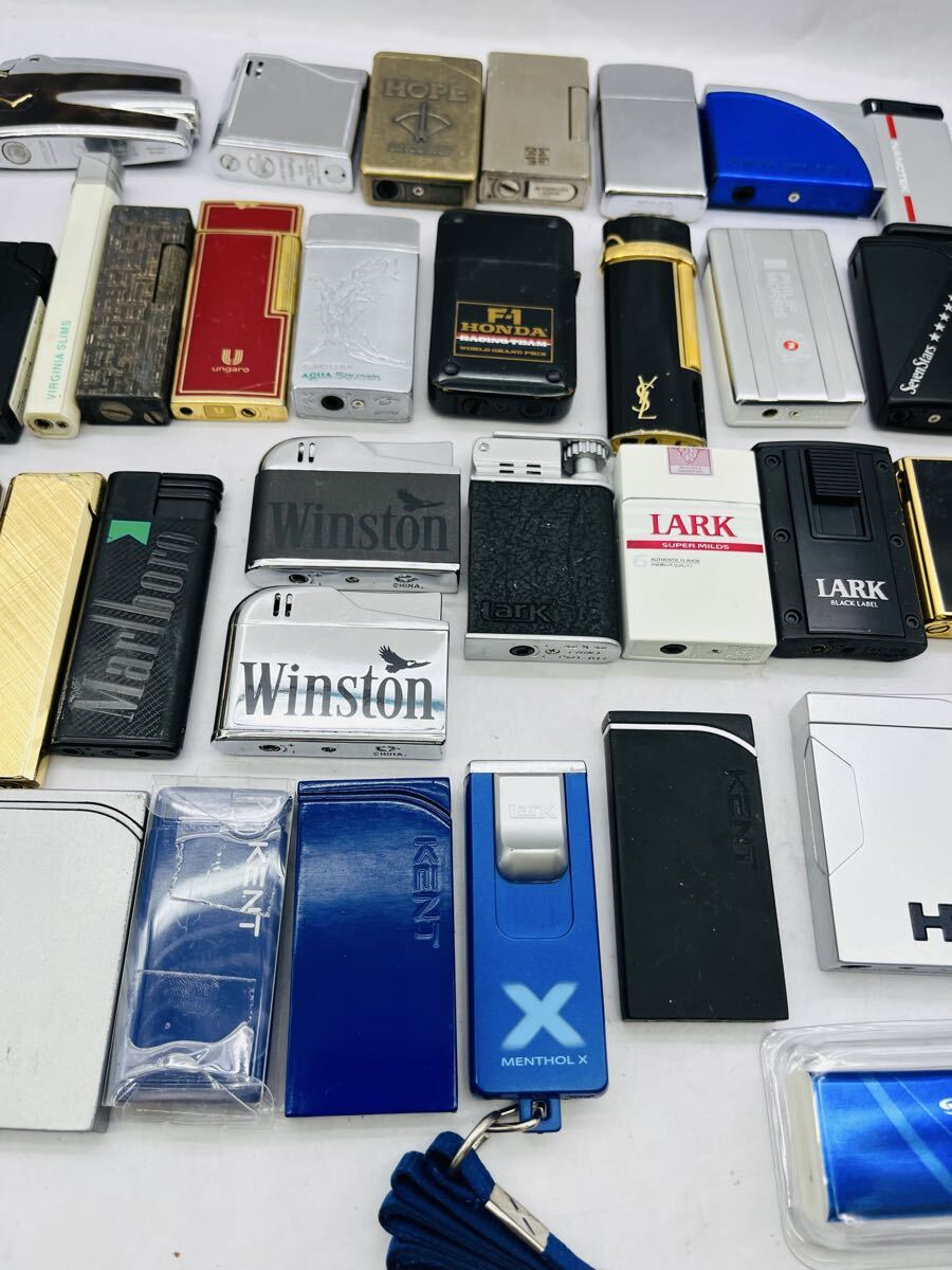 ◎1円◎ ブランド含む ライター45個まとめ売り zippo YSL ジバンシーマルマン タバコ銘柄他 色々まとめて 着火未確認 ジャンク★同梱不可_画像3