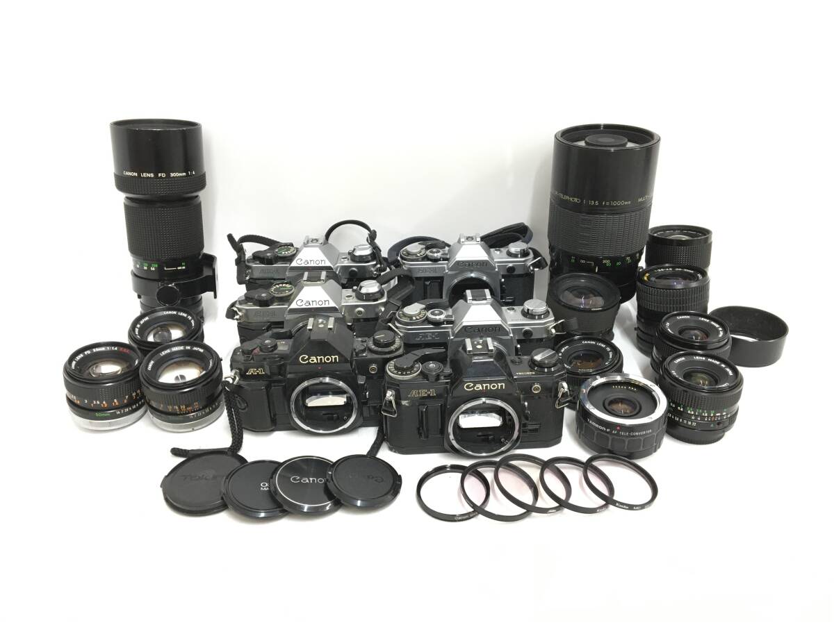 ☆ Canon フィルム一眼カメラ まとめ ☆ A-1 + AE-1 ×3 + PROGRAM ×2 + FD 300mm 1:4 + 50mm 1:1.4 S.S.C. ×3 他 レンズ8本 キャノン_画像1