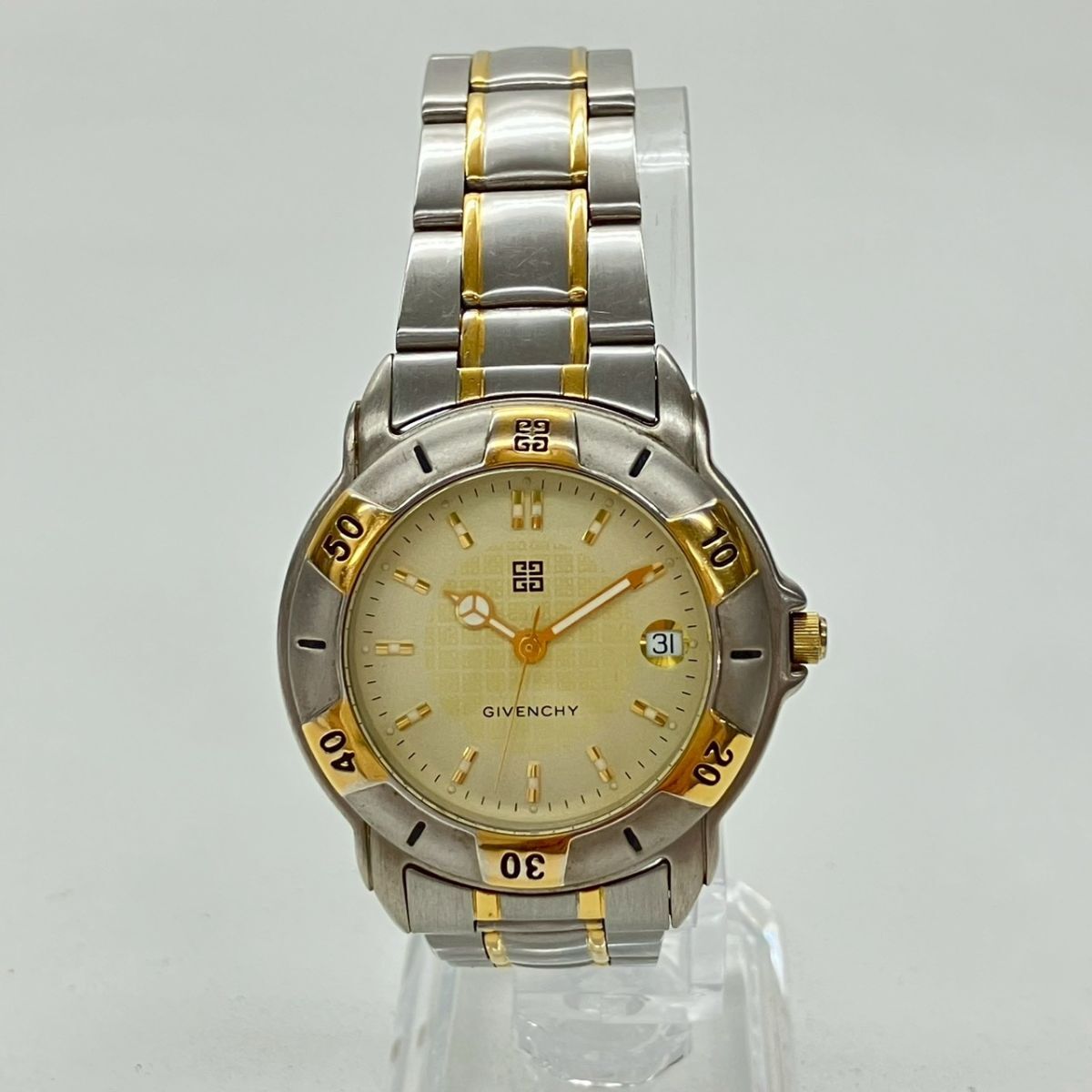 Y064-H35-329◎ GIVENCHY ジバンシイ メンズ腕時計 LIFE ライフ LT.19.XVI QUARTZ 回転ベゼル デイト ラウンド ゴールド文字盤 KA_画像2