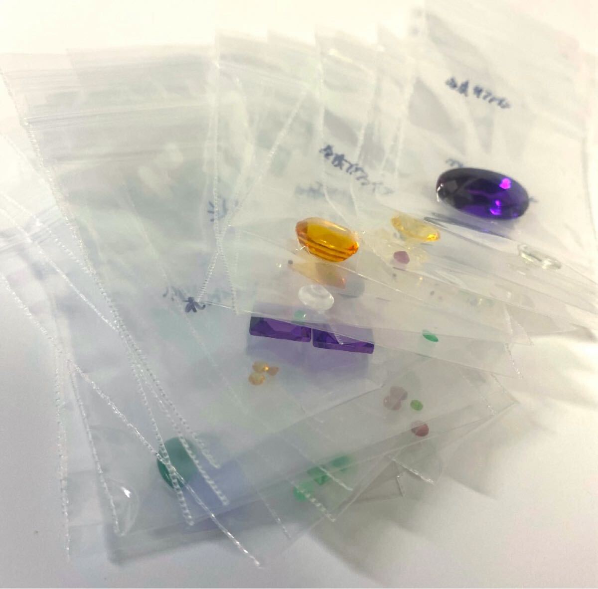 5 大量セット　25袋　エメラルド/シトリン/ルビー/グリーンアメジスト他種類不明有り　まとめ売り　 天然石色石 裸石 宝石 人工石外し石_画像1