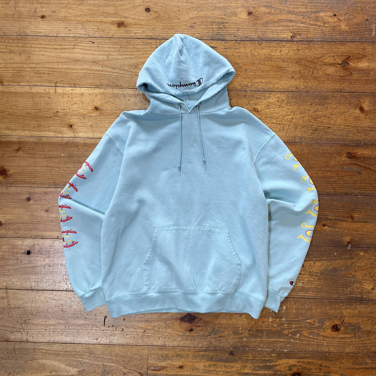 USA 古着 Champion チャンピオン スウェット パーカー ロゴ 袖プリント ライトブルー メンズL BE0158_画像1