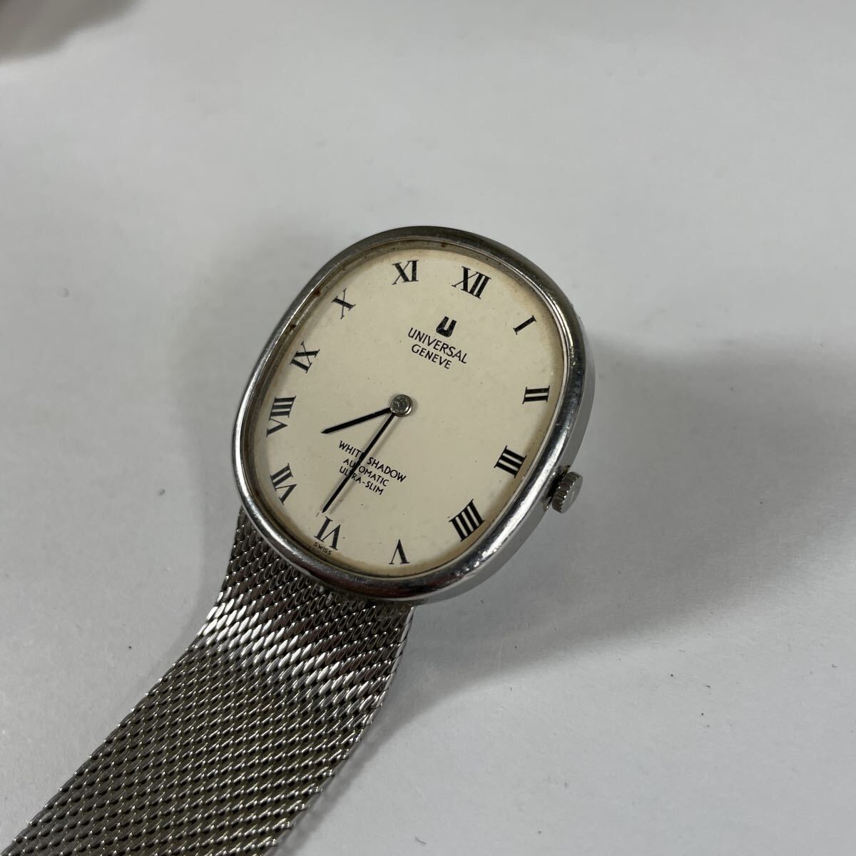 2502EL1299 UNIVERSAL GENEVE WHITE -SHADOW универсальный june-b белый Shadow самозаводящиеся часы AT наручные часы ремень оторван, отходит есть работа текущее состояние товар