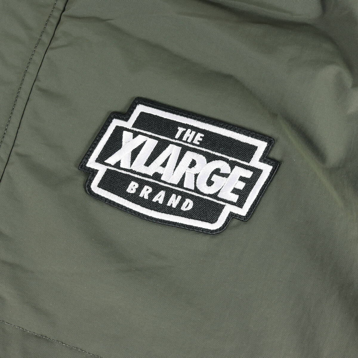 [ новый товар ]X-LARGE XLarge жакет оливковый размер :M | 23AW арка Logo подкладка стеганое полотно нейлон жакет 