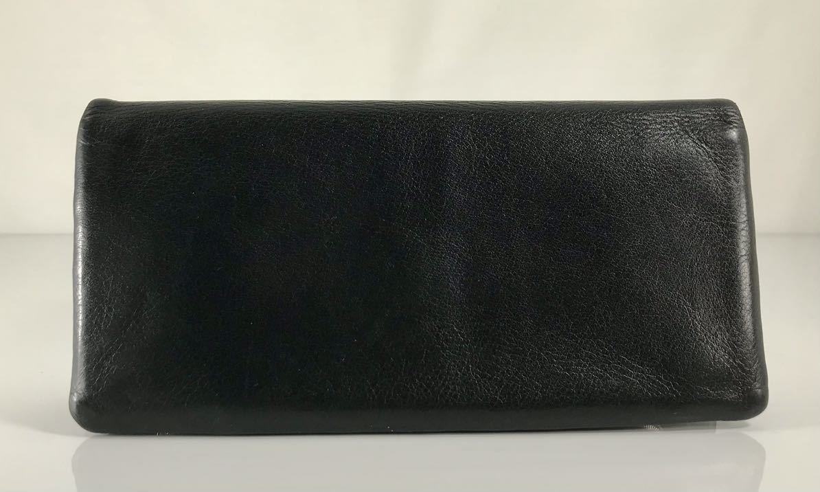 美品 agnes b VOYAGE アニエス・ベー 可愛い 2つ折り小銭入れ付き ブラック&レレッド 本革レザー 星形プル付き 軽量 長財布 です。
