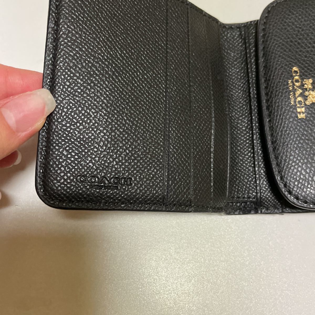 COACH 二つ折り財布