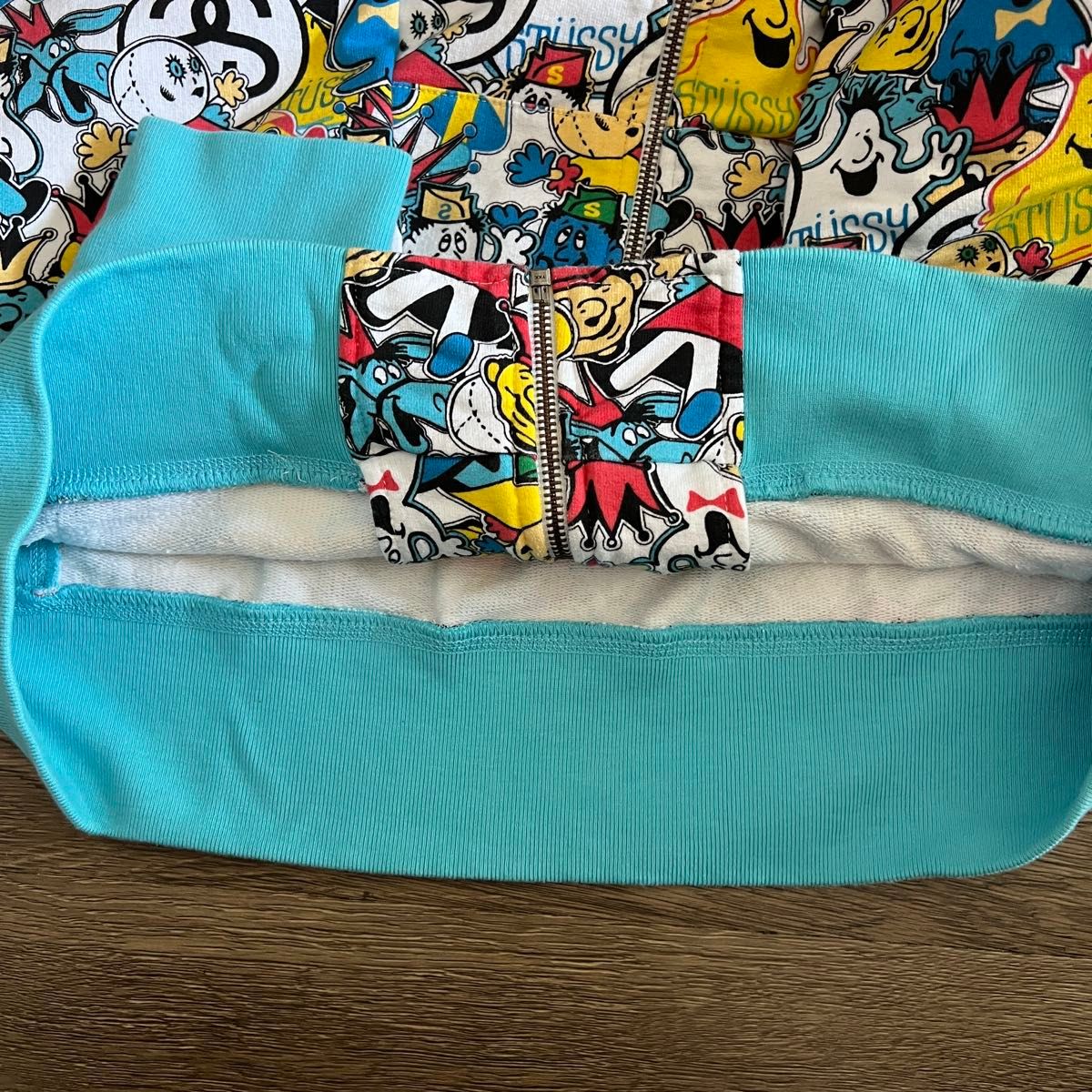 STUSSY 総柄 HEADZ ジップアップパーカー マルチカラー キャラクター